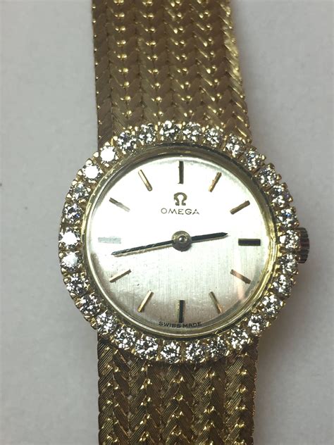 vintage i antique i 18kt yellow gold omega with cream diamond dial