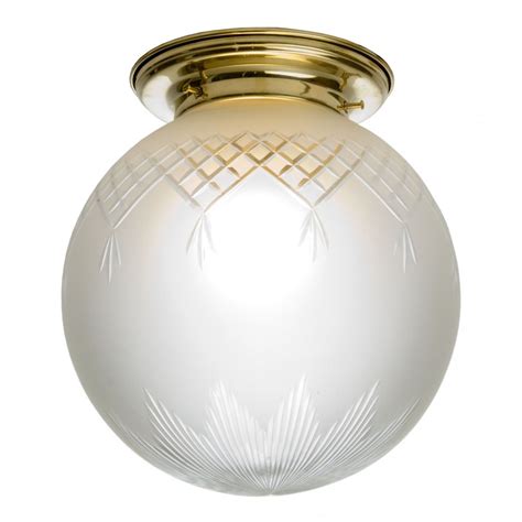 Flush Fitting Globe Glass Ceiling Light Fixed To Gold Ceiling Rose