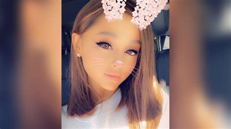 watch access hollywood interview ariana grande chops her signature locks and shows off sleek new