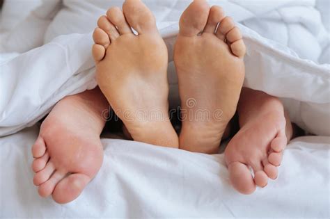 Feet Sticking Out From Blanket Stock Image Image Of