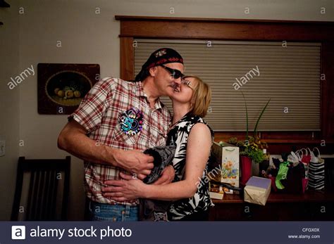 A Husband And Wife Share An Intimate Moment During A