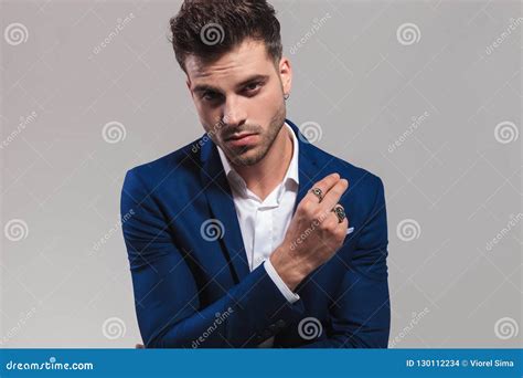 closeup picture   young elegant man snapping  fingers stock photo