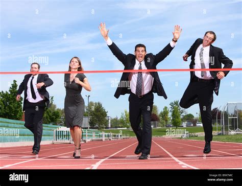 businesspeople crossing finish   track stock photo alamy