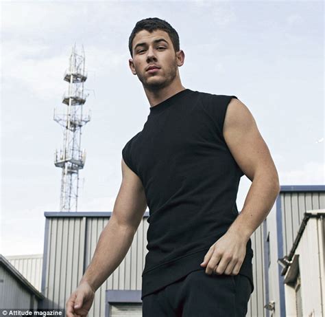 nick jonas flashes his guns on the cover of attitude magazine daily
