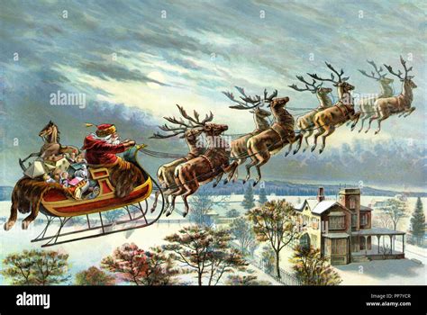 santa claus   reindeer delivering christmas gifts stock photo alamy