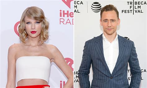 taylor swift and tom hiddleston spotted kissing at selena gomez concert