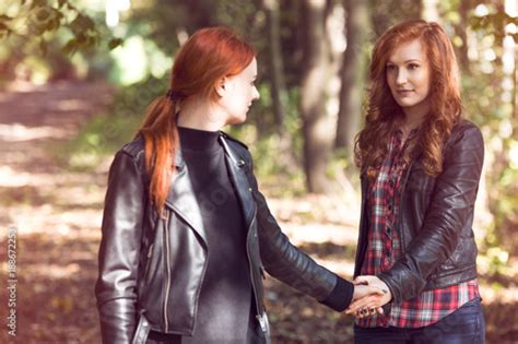 red haired lesbian girlfriends in the forest stock foto adobe stock