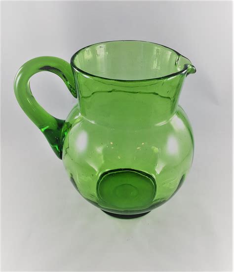 vintage green glass pitcher blown glass pitcher uranium glass pitcher