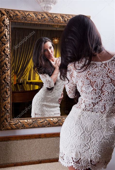 Beautiful Girl In A Short White Dress Looking Into Mirror Sensual Woman