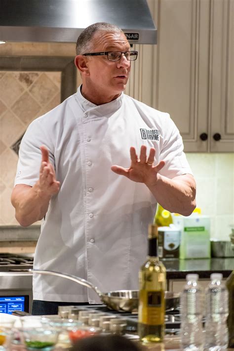 chef robert irvine giving  audience cooking tips  gerhards appliances chef robert