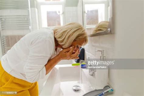 Older Woman Washing Face Photos And Premium High Res Pictures Getty