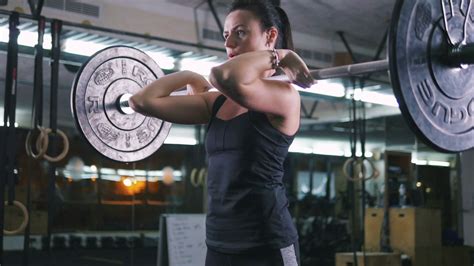 empowered woman lifting weights at gym slow stock footage sbv 338298207