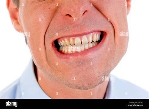 young man showing teeth stock photo alamy