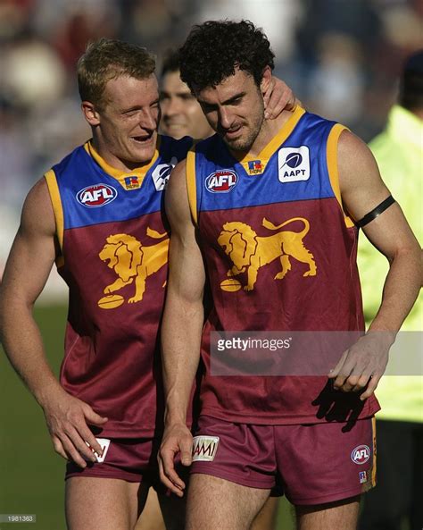 michael voss 3 congratulates nigel lappin 44 for the lions after the round six afl match