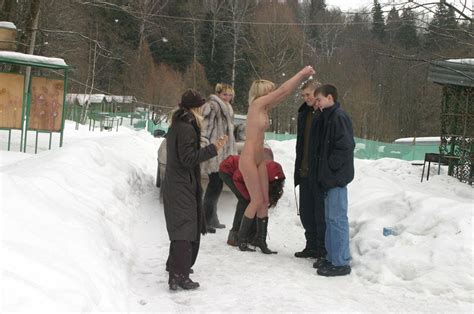 naked blonde plays snowballs with her friends at winter road russian sexy girls