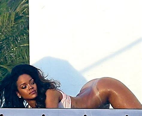 can this girl get any hotter rihanna poses semi nude for