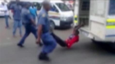 south african cop filmed beating woman