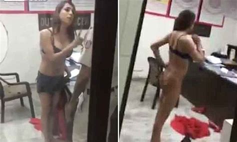 furious woman strips off to just her bra as she argues