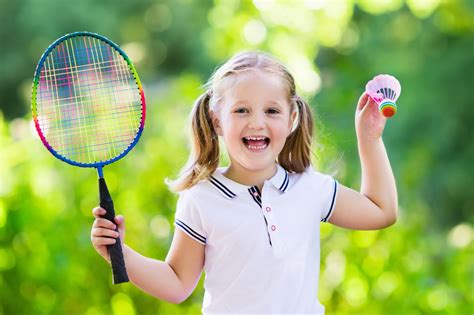 child playing badminton  tennis outdoor  summer careers  sport