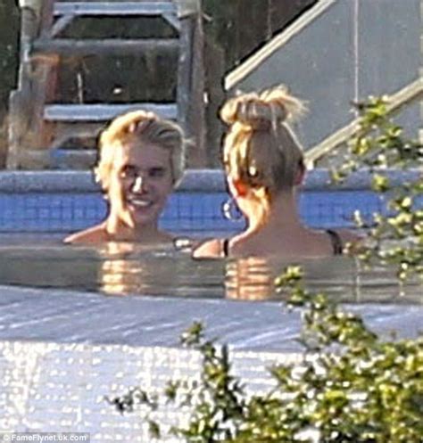 Justin Bieber Soaks Up Sun In His Pool With Bikini Clad Hailey Baldwin