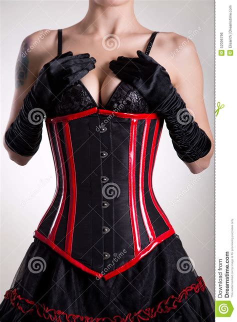 Busty Fetish Woman In Black And Red Corset And Skirt Stock
