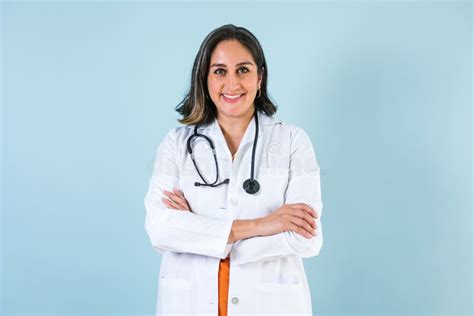 Hispanic Doctor Woman Portrait With Copy Space Over Blue Background