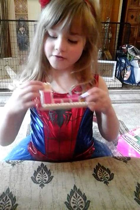 5 Year Old Girl Having Fun Building Barbie Mansion House