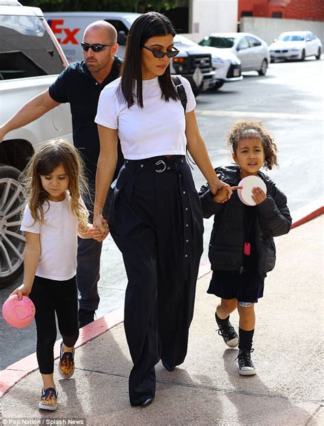 kourtney kardashian steps out with daughter penelope and niece north