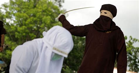 shocking moment indonesian woman is whipped by masked sharia law enforcer for committing