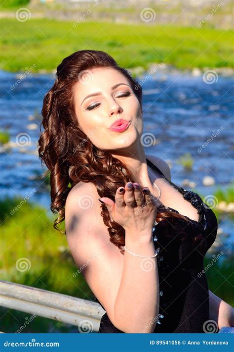 attractive beauty giving flying kisses portrait stock photo image  blue beauty