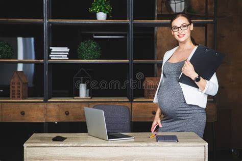 Pregnant Businesswoman Pregnant Mature Businesswoman Working At Office