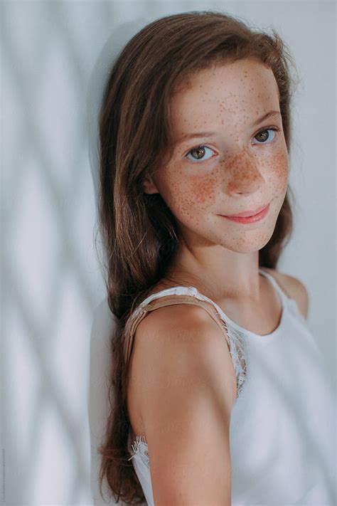 closeup portrait of adorable girl with lots of freckles