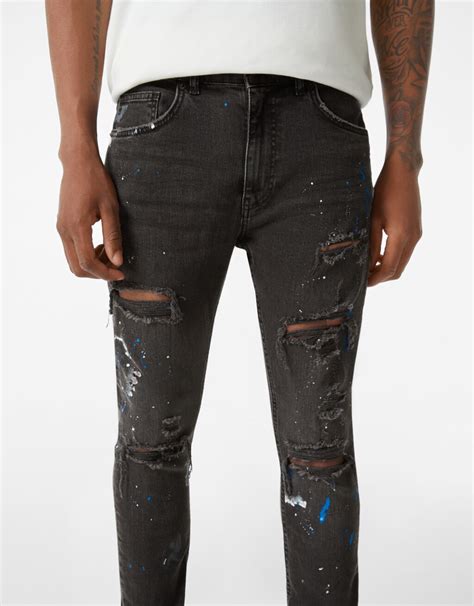 ripped paint splatter skinny jeans woman bershka
