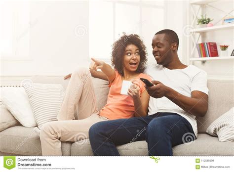 Happy African American Couple Watching Tv At Home Stock Image Image
