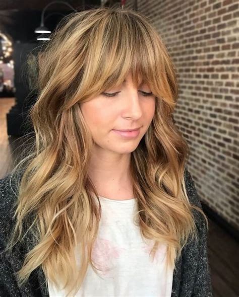 20 incredible layered hairstyles with bangs 2023 guide wtyh