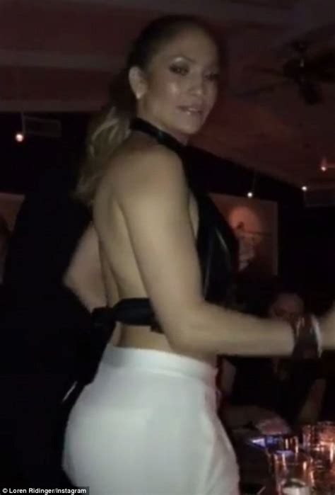 jennifer lopez shows off bodacious backside in white trousers as she