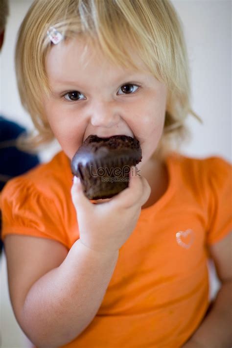 Girl Eating Chocolate Muffin Picture And Hd Photos Free Download On