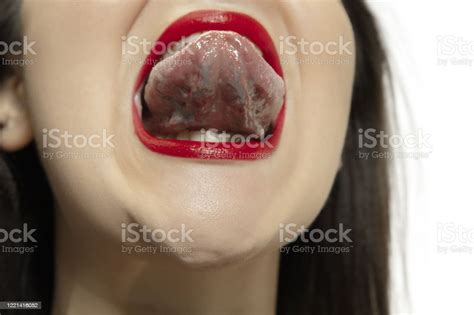 smiling girl opening her mouth with red lips and showing the long big