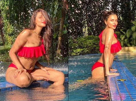 akshara gowda flaunts her fantastic figure in red one shoulder bikini
