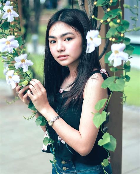 image may contain 1 person flower filipina beauty ideal girl