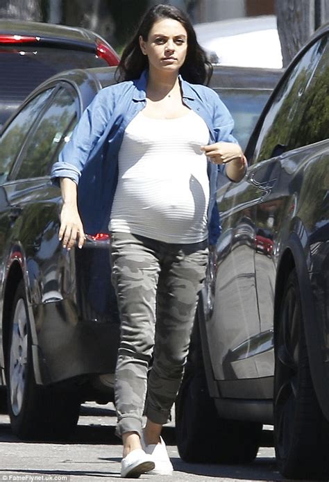 Pregnant Mila Kunis Displays Growing Bump In Casual Denim Shirt In La