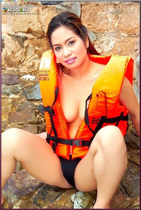 beautiful asian babe wearing a life jacket and showing her horny poses asian porn movies