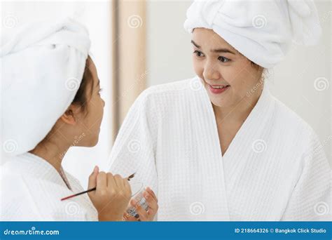 cute asian girl   spa dress  head covered   white towel