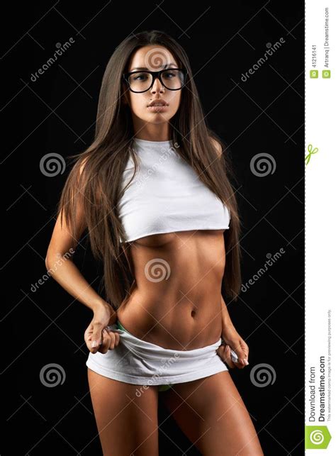 beautiful slim girl on a black background stock image