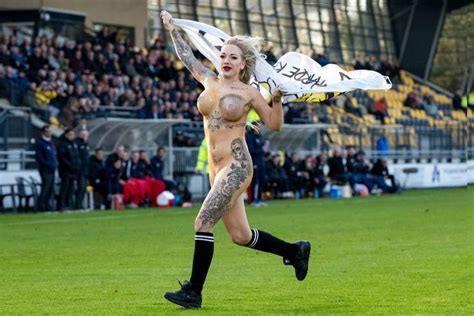 dutch football fans hire busty tattooed stripper to invade pitch wearing nothing more than body