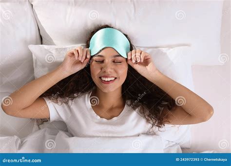 Happy African American Woman With Sleeping Mask In Bed Top View Stock