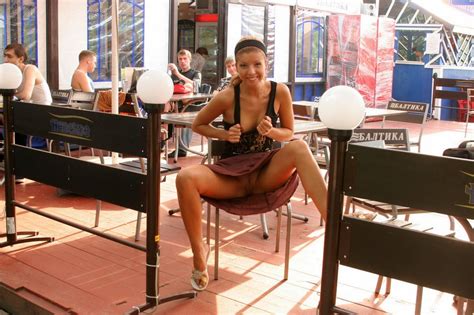 girl flashing pussy at a table in public voyeur pictures