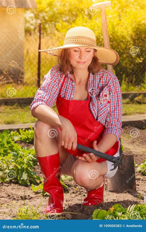 woman with gardening tool working in garden stock image image of