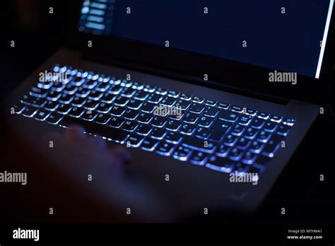 programmer  computer hacker typing code  laptop keyboard late night