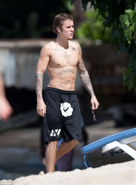 shirtless justin bieber shows off physique as he hits